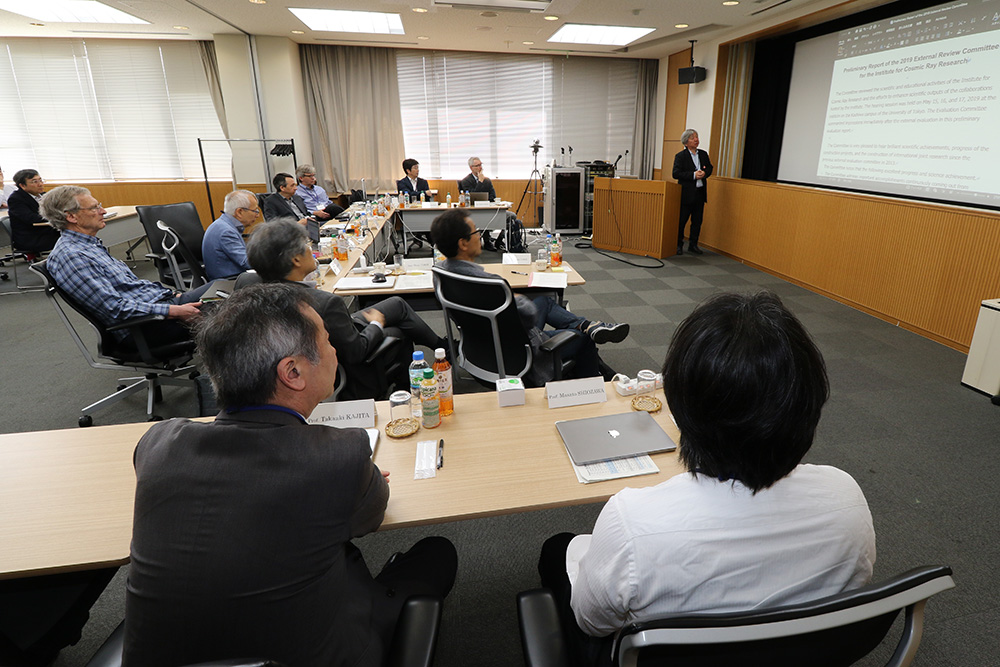 Chairperson Miyama presenting the preliminary report